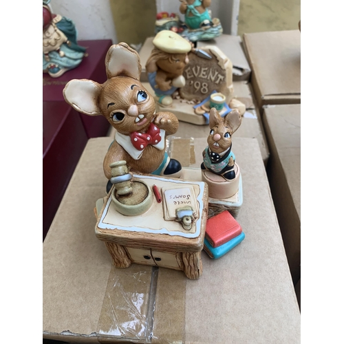 390 - Nine boxed Pendelfin items, one Cottage display stand and eight rabbit figurines to include Gramps, ... 