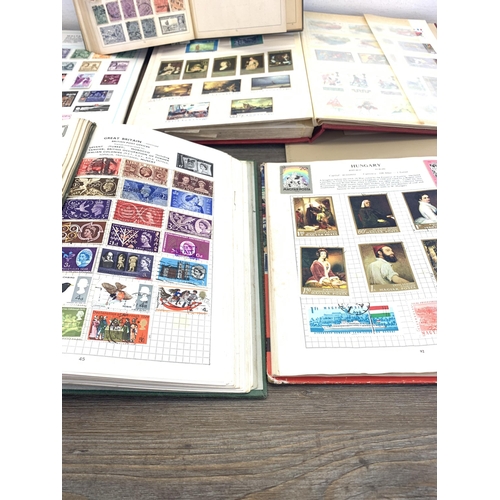 481 - Eight stamp albums containing a collection of worldwide stamps