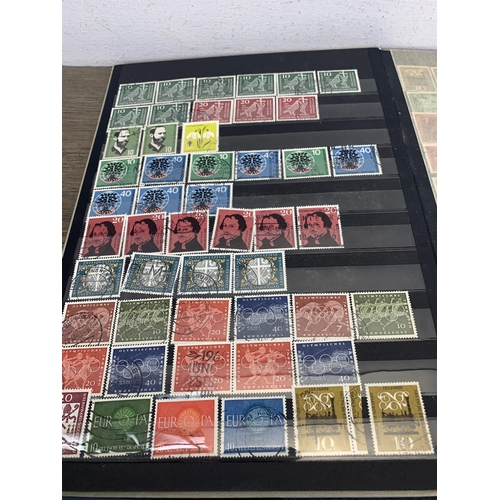 484 - Five stamp albums containing a collection of worldwide stamps