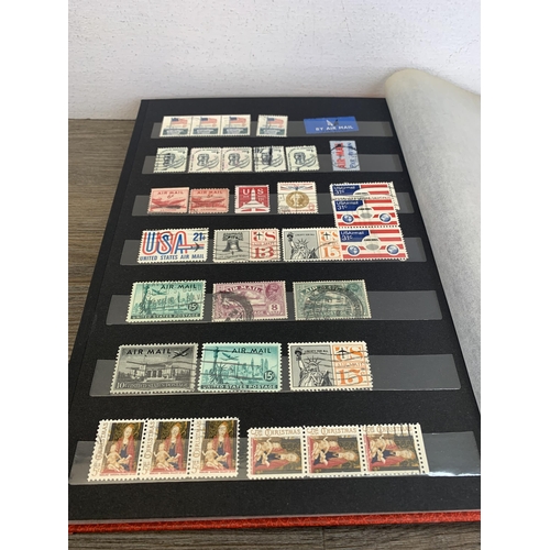 484 - Five stamp albums containing a collection of worldwide stamps