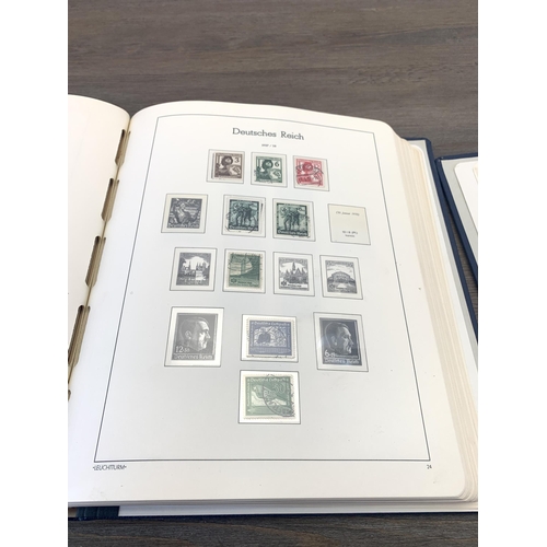 484 - Five stamp albums containing a collection of worldwide stamps