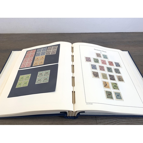 484 - Five stamp albums containing a collection of worldwide stamps