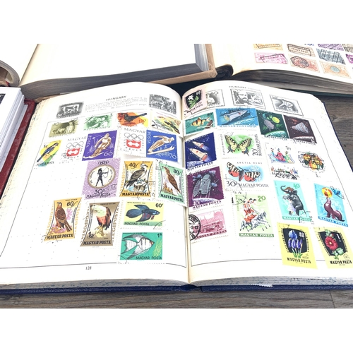 486 - Five albums containing a collection of worldwide stamps