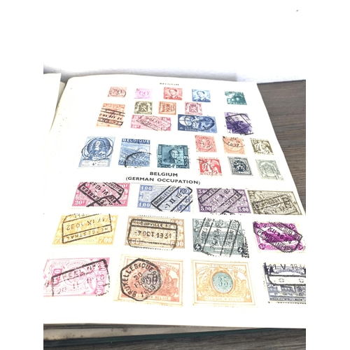 486 - Five albums containing a collection of worldwide stamps