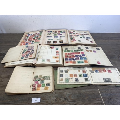 495 - Four stamp albums and three stock books containing a collection of worldwide stamps