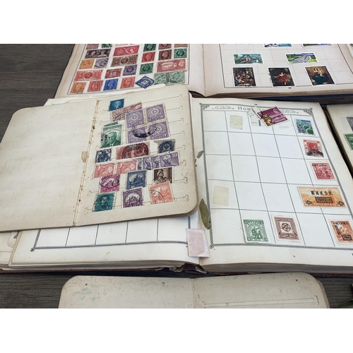 495 - Four stamp albums and three stock books containing a collection of worldwide stamps