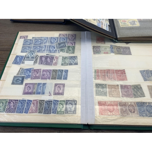 496 - Six albums and two stock books containing a collection of worldwide stamps