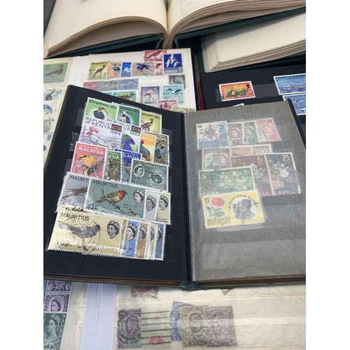 496 - Six albums and two stock books containing a collection of worldwide stamps