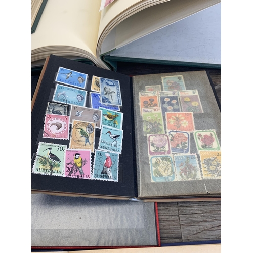 496 - Six albums and two stock books containing a collection of worldwide stamps