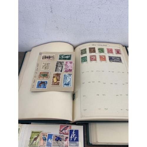 496 - Six albums and two stock books containing a collection of worldwide stamps