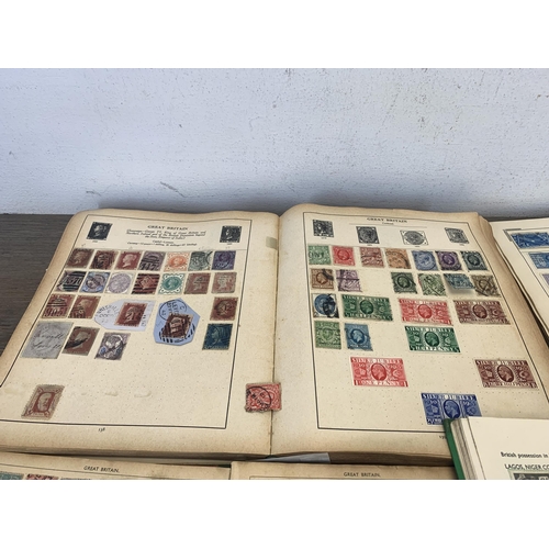 499 - Seven albums containing a collection of worldwide stamps