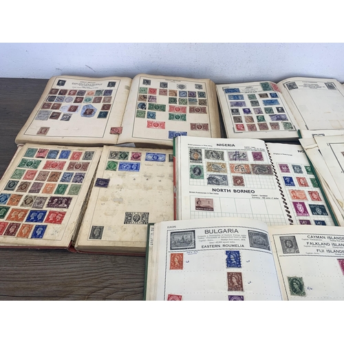 499 - Seven albums containing a collection of worldwide stamps