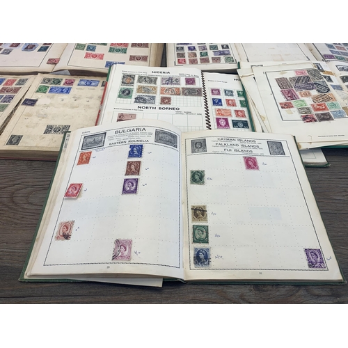 499 - Seven albums containing a collection of worldwide stamps