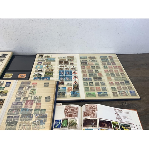 500 - Seven albums and two stock books containing a collection of worldwide stamps