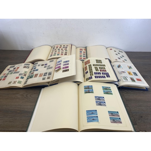 501 - Seven albums containing a collection of worldwide stamps