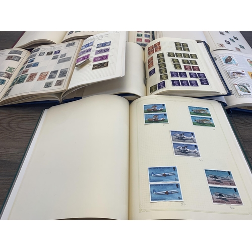 501 - Seven albums containing a collection of worldwide stamps