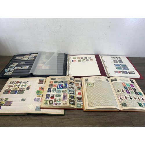 502 - Six albums containing a collection of worldwide stamps