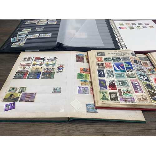 502 - Six albums containing a collection of worldwide stamps