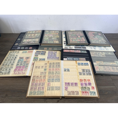 509 - Seven albums containing a collection of worldwide stamps