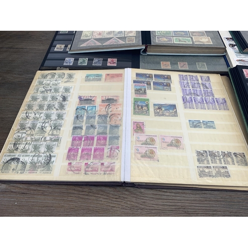 509 - Seven albums containing a collection of worldwide stamps