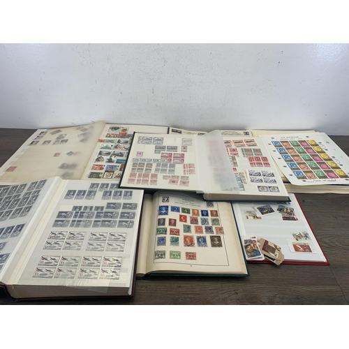 513 - Six albums containing a collection of worldwide stamps