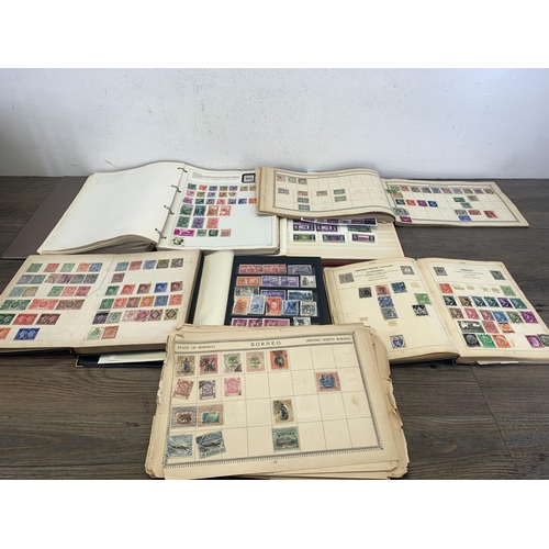 514 - Three albums and two stock books containing a collection of worldwide stamps