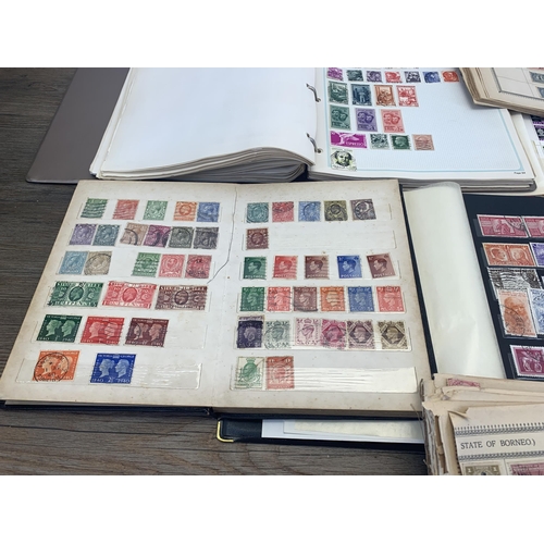 514 - Three albums and two stock books containing a collection of worldwide stamps