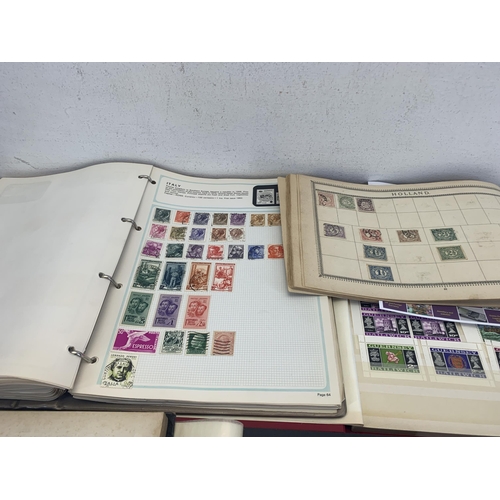 514 - Three albums and two stock books containing a collection of worldwide stamps