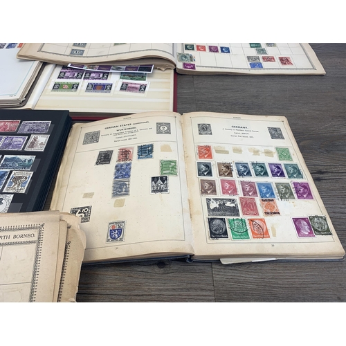 514 - Three albums and two stock books containing a collection of worldwide stamps