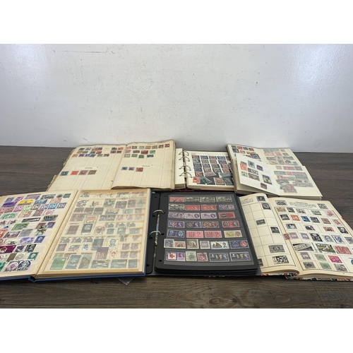 515 - Five albums and two stock books containing a collection of worldwide stamps