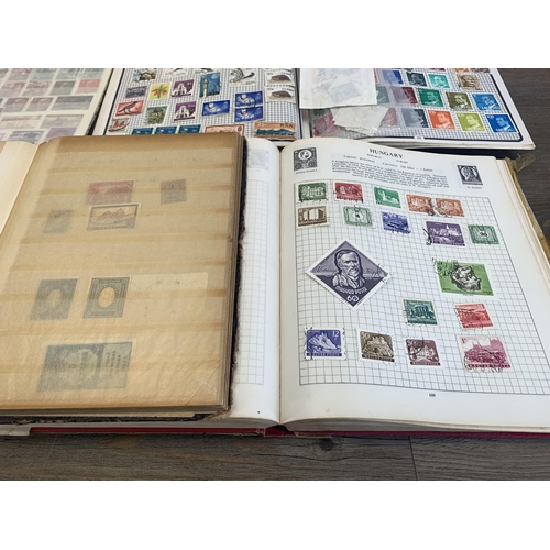 516 - Seven albums containing a collection of worldwide stamps