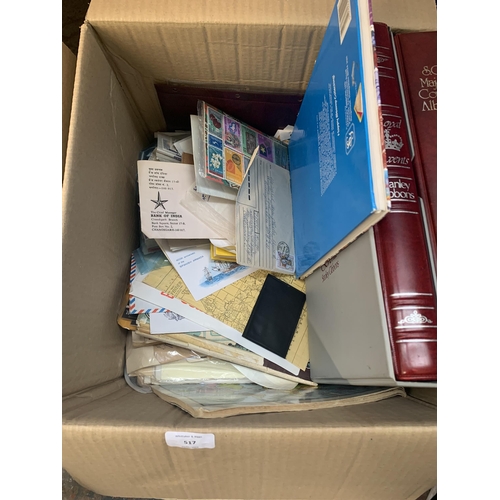 517 - A box containing a large quantity of loose stamps and first day covers