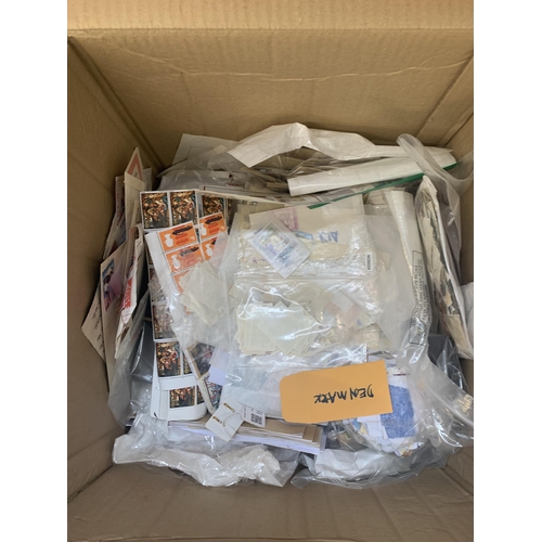 520 - A box containing a large quantity of loose stamps and first day covers