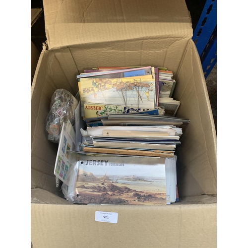 521 - A box containing a large quantity of loose stamps and first day covers