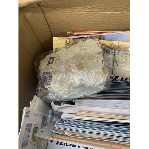 521 - A box containing a large quantity of loose stamps and first day covers