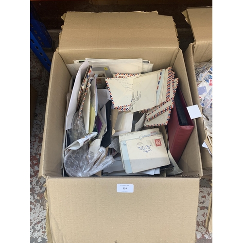 524 - A box containing a large quantity of loose stamps and first day covers