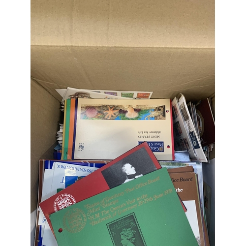 525 - A box containing a large quantity of loose stamps and first day covers