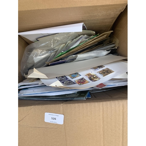 526 - A box containing a large quantity of loose stamps and first day covers