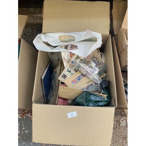 527 - A box containing a large quantity of loose stamps and first day covers