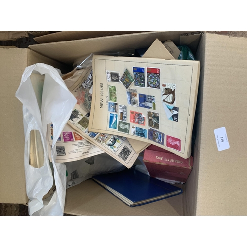 527 - A box containing a large quantity of loose stamps and first day covers