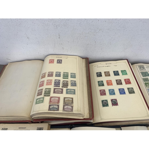 534 - Seven albums containing a collection of worldwide stamps