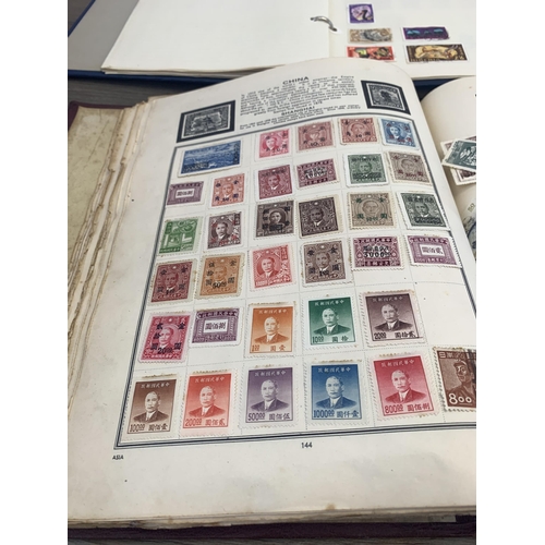 542 - Six albums containing a collection of worldwide stamps