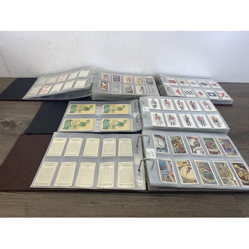 545 - Four albums containing a collection of cigarette cards