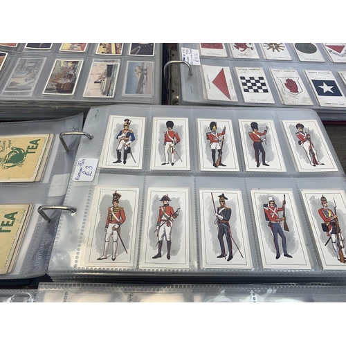 545 - Four albums containing a collection of cigarette cards