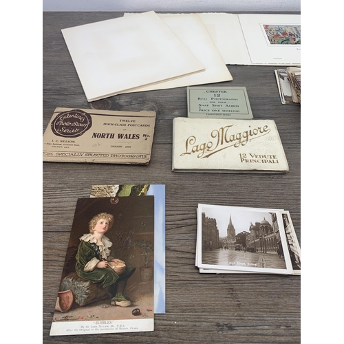 548 - A collection of vintage postcards together with Brocklehurst-Whiston of Macclesfield Silks to includ... 