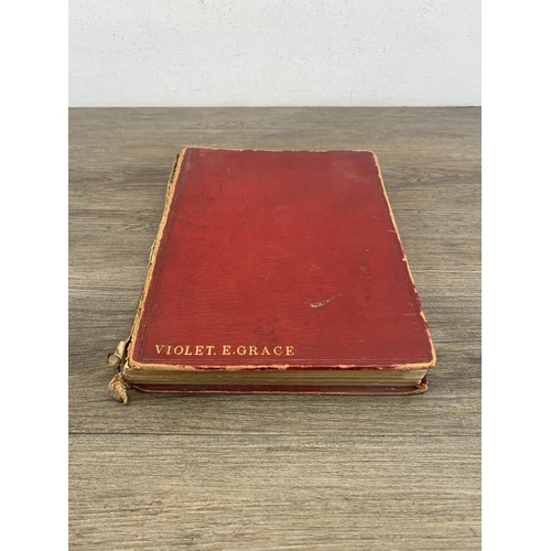 550 - A late 19th century scrap album containing a large quantity of hand written and painted poems and dr... 