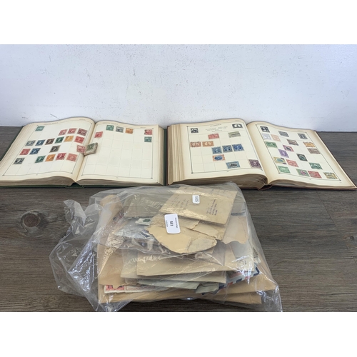 551 - Two Strand stamp albums containing a collection of worldwide stamps together with a large quantity o... 