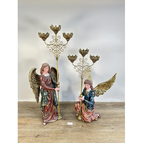 556 - A pair of contemporary angel three branch candelabras - largest approx. 68cm high