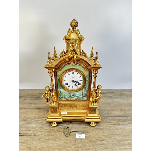 559 - A 19th century style Kienzle gilt metal chiming mantel clock - approx. 45cm high x 24cm wide x 19cm ... 