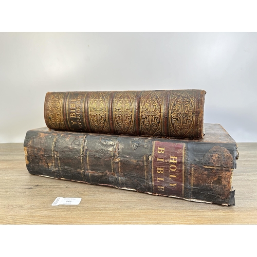 562 - Two 19th century leather bound Bibles, the larger dated 1807